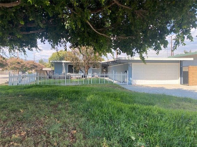 view of front of home with a garage and a front yard