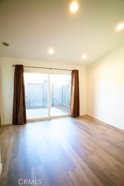 empty room featuring wood-type flooring