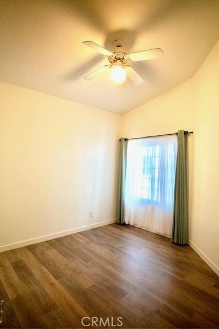 unfurnished room featuring ceiling fan, dark hardwood / wood-style floors, and lofted ceiling