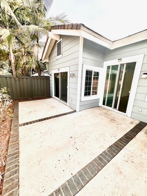 rear view of property featuring a patio