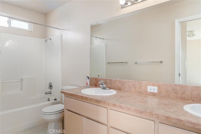 full bathroom featuring toilet, vanity, and shower / tub combination