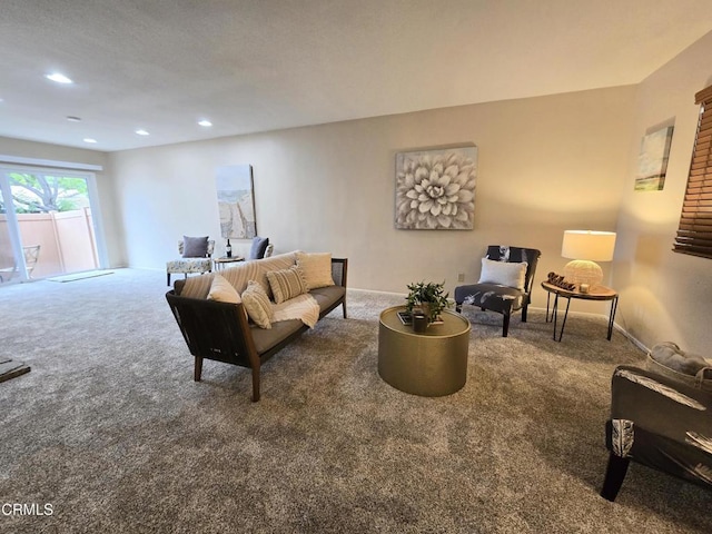 carpeted living area with recessed lighting and baseboards