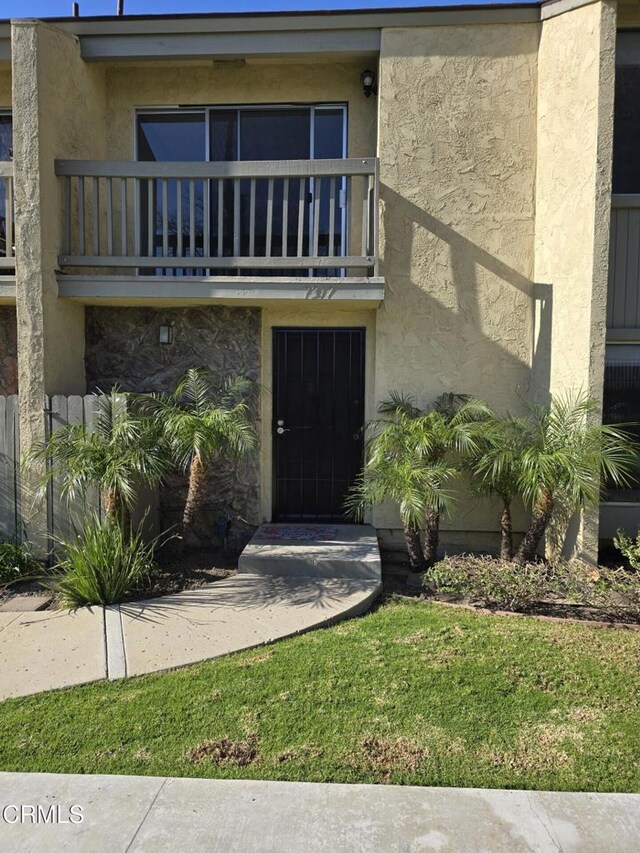 doorway to property featuring a balcony