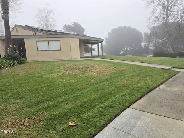 view of yard featuring a carport