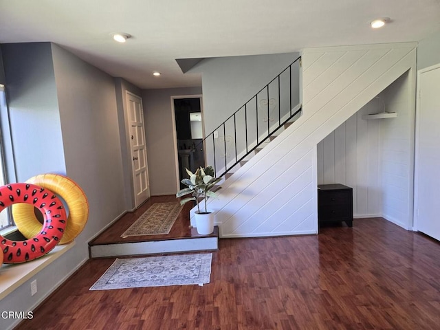 foyer entrance with dark hardwood / wood-style floors