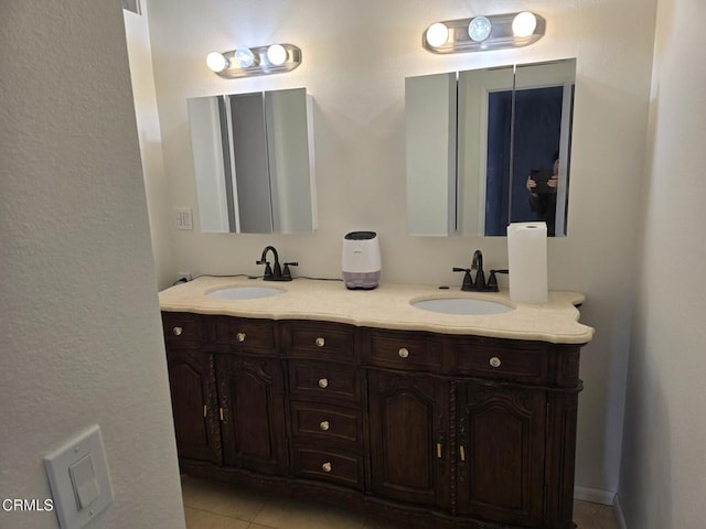 bathroom featuring tile patterned floors and vanity