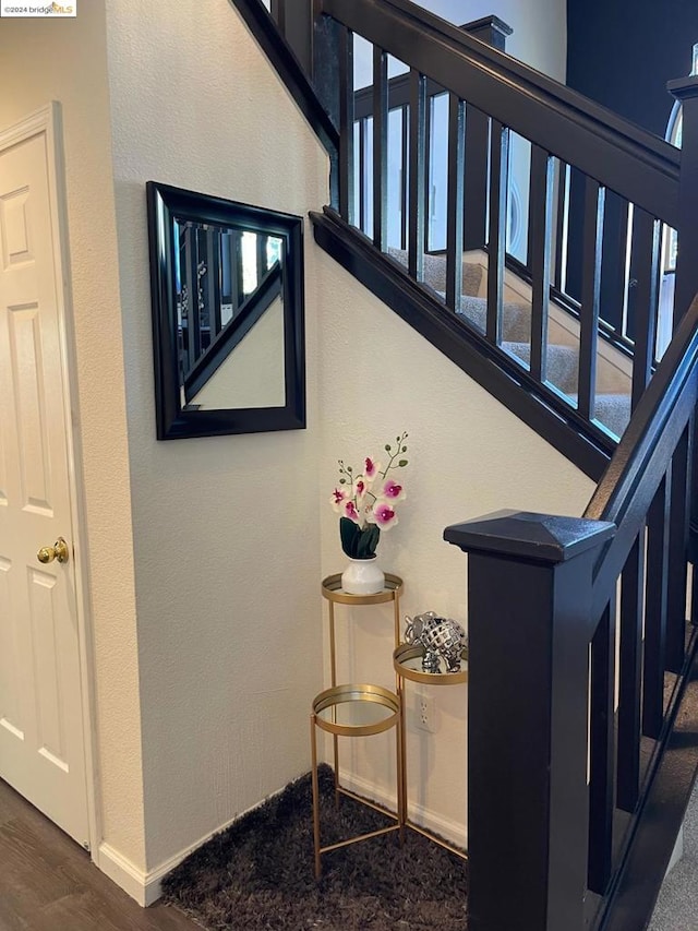 stairs with wood-type flooring