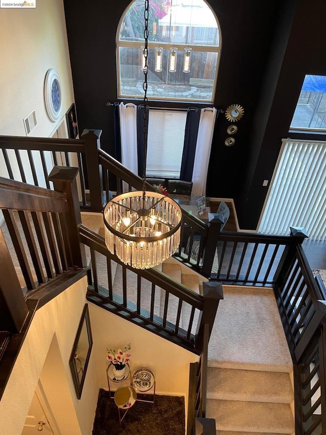 interior space with an inviting chandelier and carpet