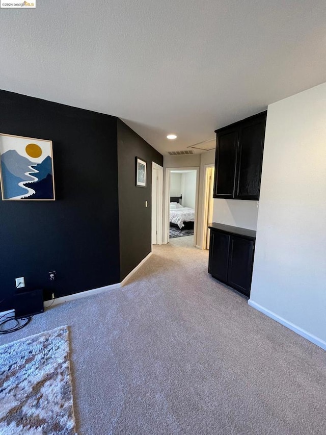 interior space featuring a textured ceiling