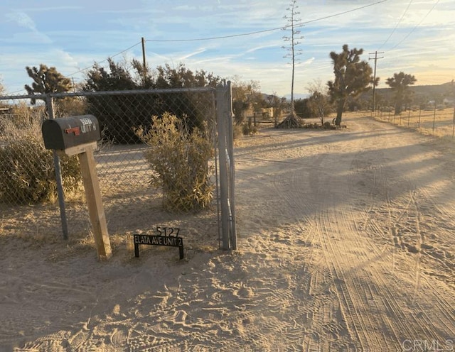 view of gate featuring a rural view