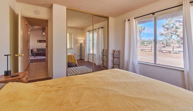 unfurnished bedroom with a textured ceiling