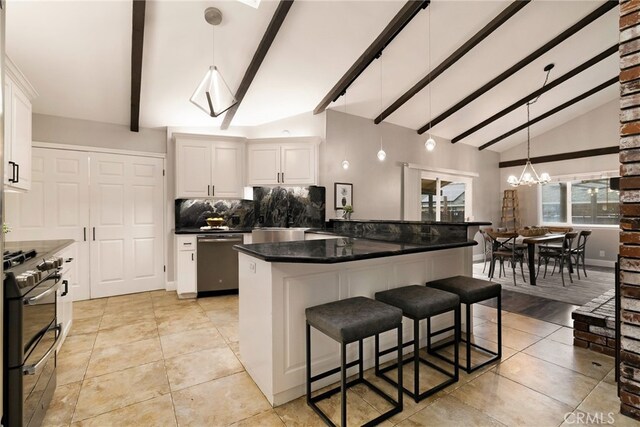 kitchen featuring white cabinetry, lofted ceiling with beams, hanging light fixtures, and black gas range oven