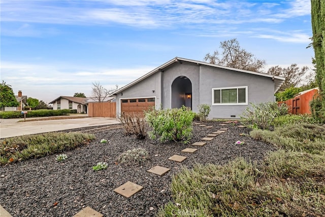 ranch-style house featuring a garage