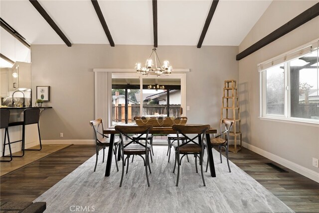 dining space with vaulted ceiling with beams, dark wood-type flooring, and a chandelier