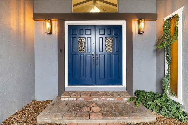 property entrance featuring french doors