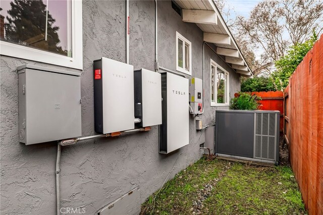 view of side of home with cooling unit