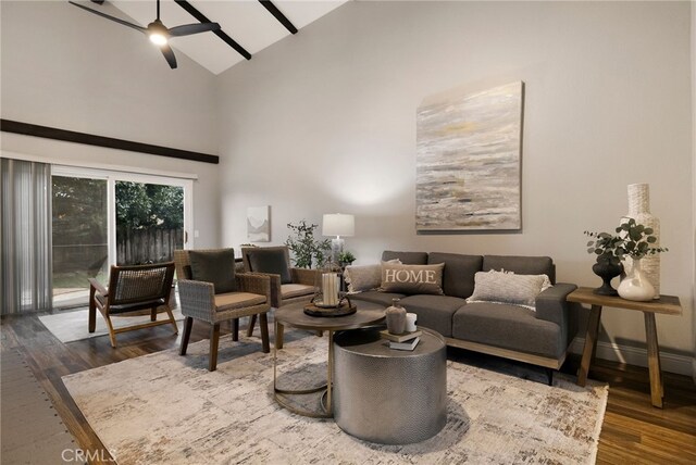 living room featuring high vaulted ceiling, dark wood-type flooring, and ceiling fan