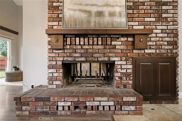 room details featuring hardwood / wood-style flooring and a fireplace