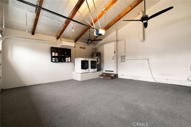 garage with a garage door opener, hybrid water heater, washer and dryer, and ceiling fan