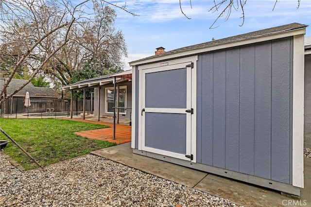 view of outbuilding featuring a lawn