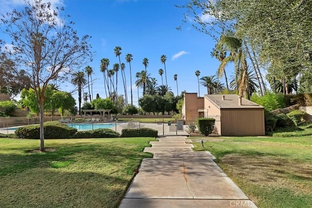 view of yard featuring a community pool