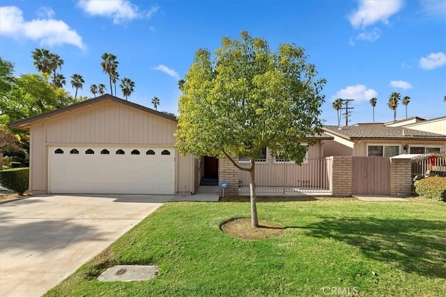 single story home featuring a garage and a front lawn