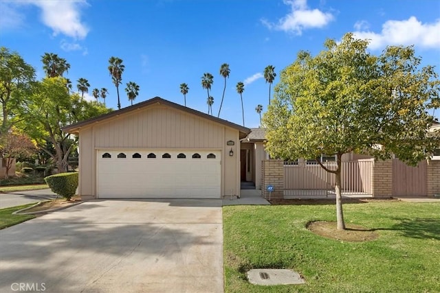 single story home with a garage and a front yard