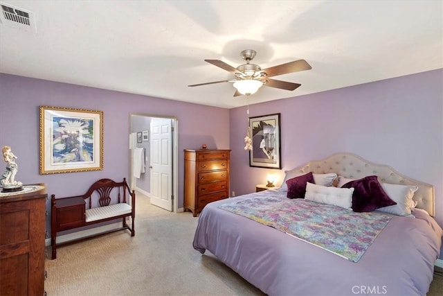 bedroom with ceiling fan and light colored carpet