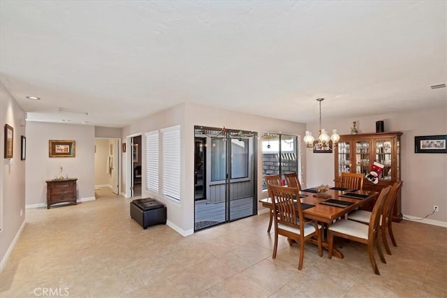 dining room with a chandelier