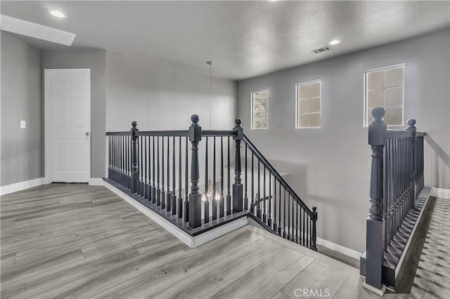 staircase featuring hardwood / wood-style floors