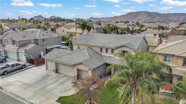 birds eye view of property with a mountain view