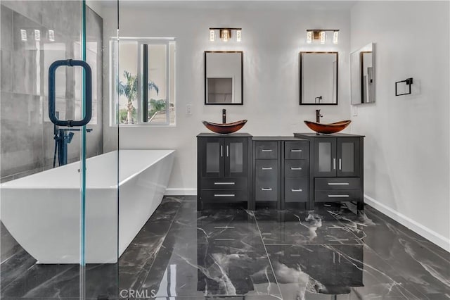 bathroom with vanity and a bath