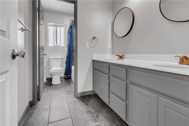 full bathroom with toilet, vanity, and shower / tub combo with curtain