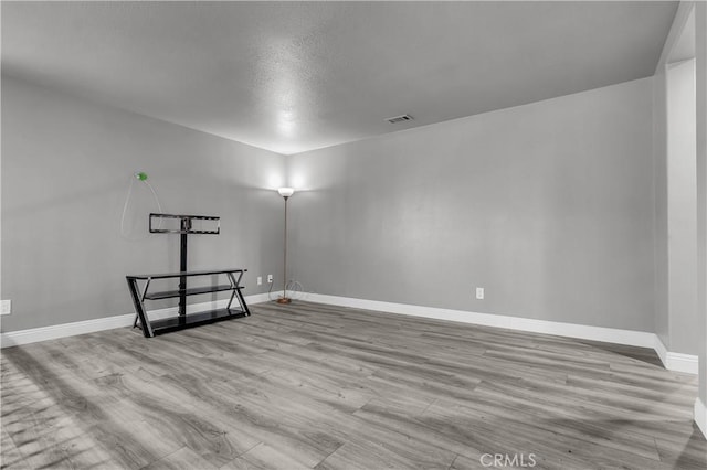 spare room featuring light hardwood / wood-style flooring