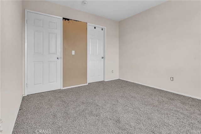 unfurnished bedroom with carpet