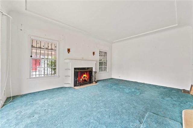 unfurnished living room featuring carpet