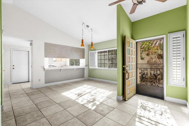 tiled entryway with vaulted ceiling and ceiling fan