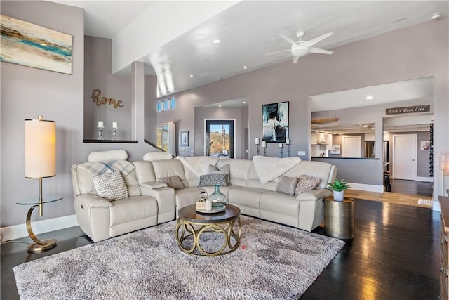 living room featuring dark hardwood / wood-style floors and ceiling fan