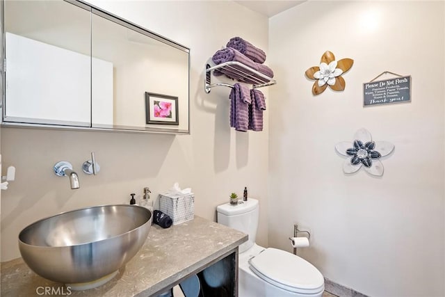 bathroom with vanity and toilet