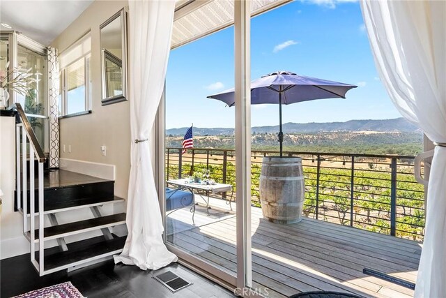 doorway to outside featuring a mountain view, baseboards, and visible vents