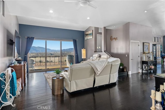 living room with dark wood-type flooring and ceiling fan