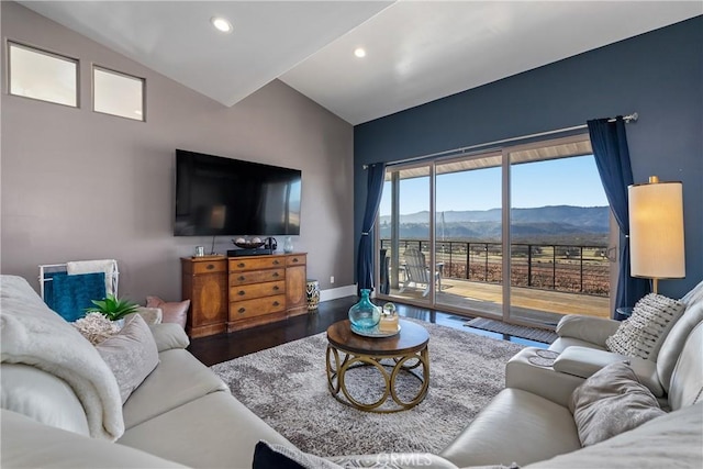 living room featuring recessed lighting, wood finished floors, baseboards, and vaulted ceiling