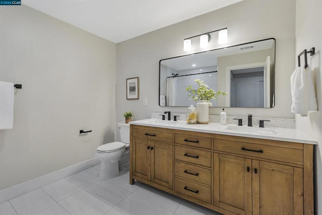 bathroom featuring vanity, tile patterned flooring, curtained shower, and toilet