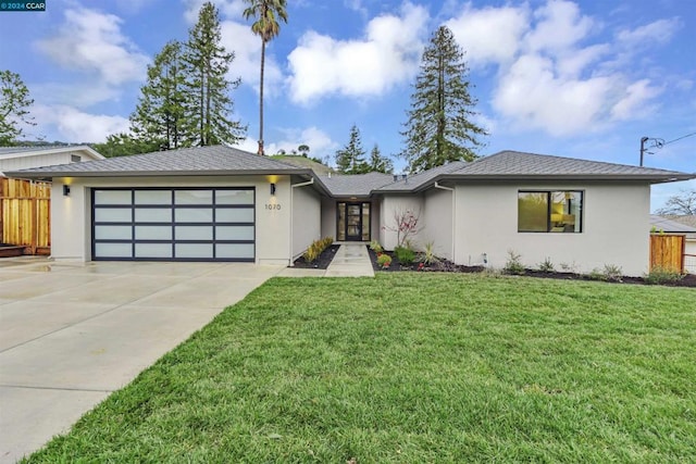 view of front facade with a garage and a front yard