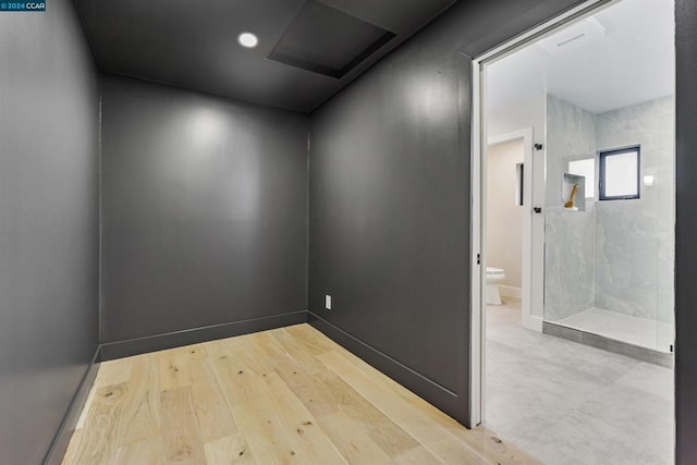 spare room featuring light wood-type flooring