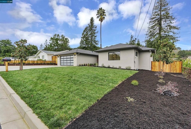 ranch-style house with a front yard and a garage