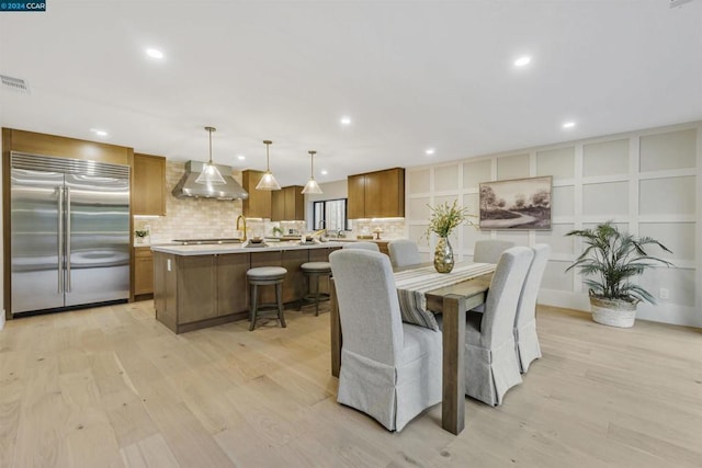 dining space featuring light wood-type flooring