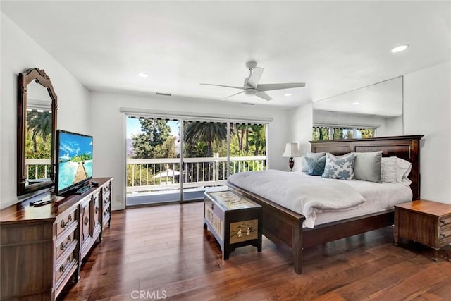 bedroom with ceiling fan, access to exterior, and dark wood-type flooring