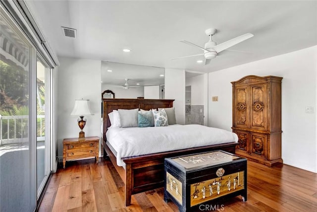 bedroom with ceiling fan, hardwood / wood-style floors, and access to outside