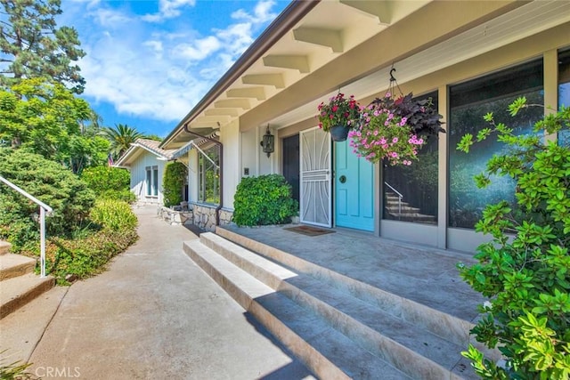 property entrance featuring a patio